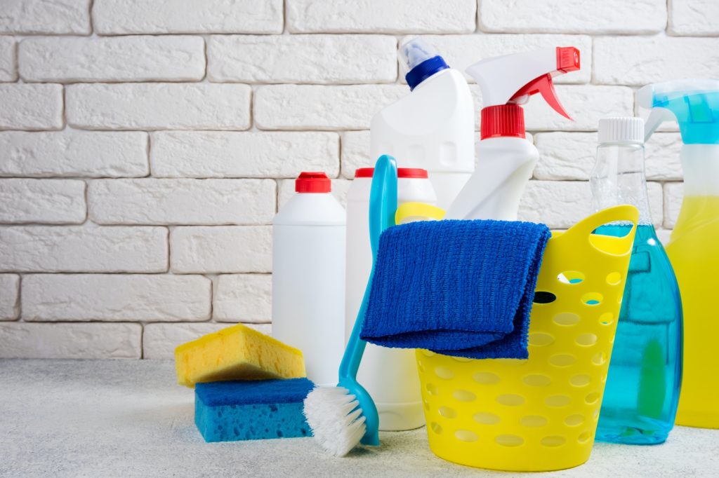 Cleaning background. Basket with cleaning products. Cleaning with supplies, service and clean house